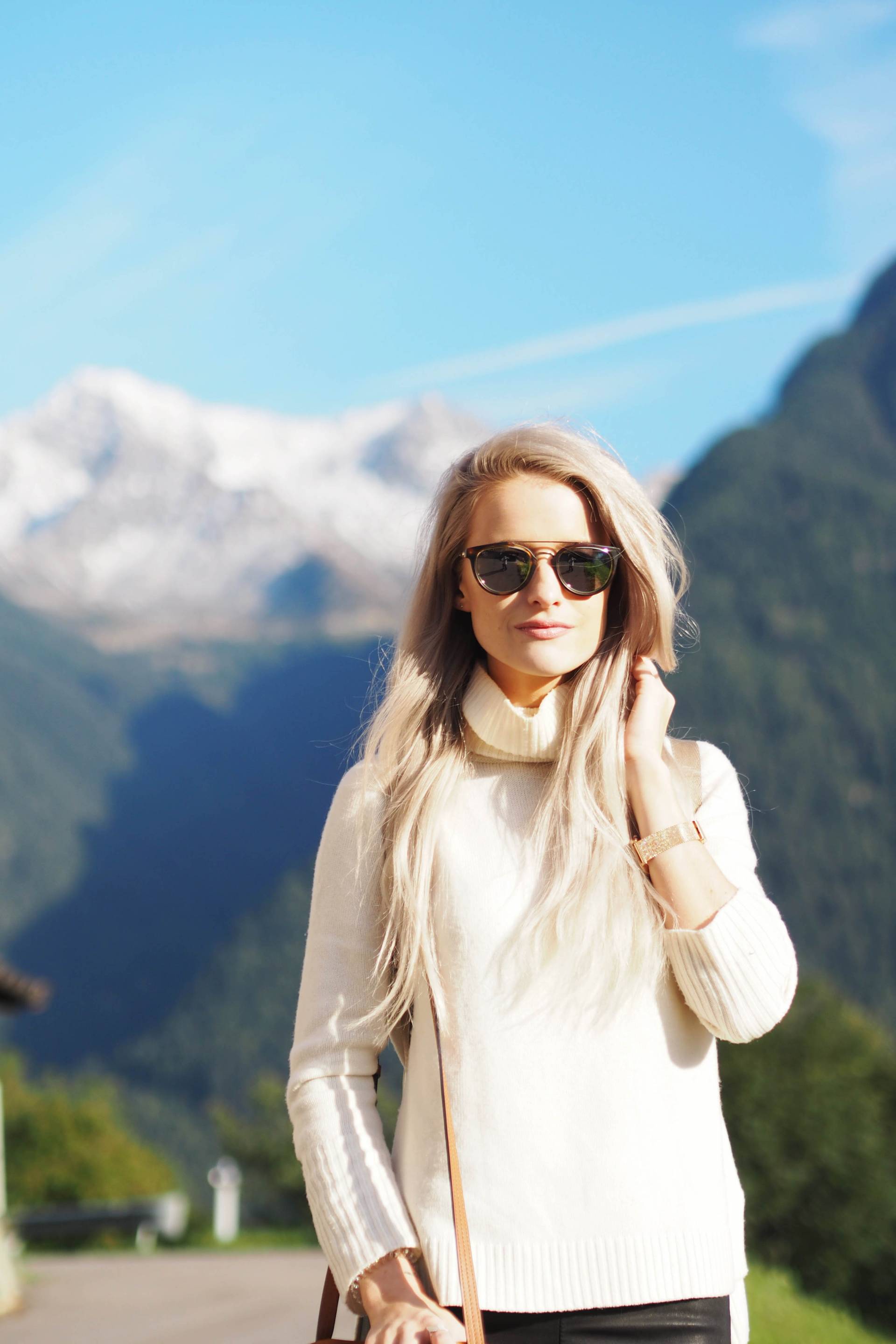 white hair inthefrow in south tyrol, north italy in revolve clothing and Maje suede jacket